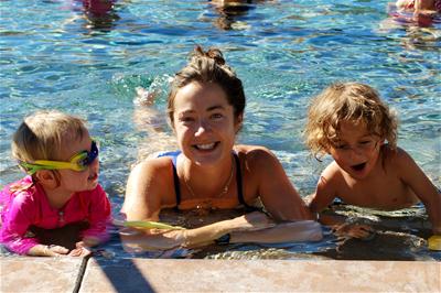 Family relaxing at the pool